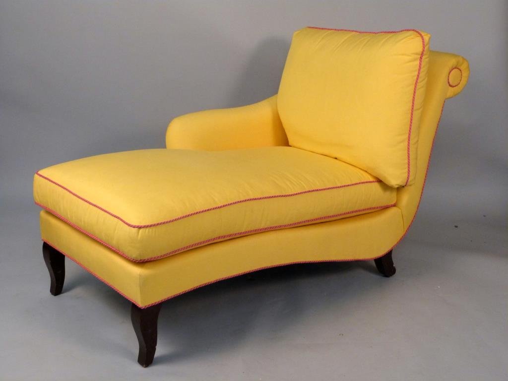 Mid-Century Style Chaise Lounge: Upholstered in yellow fabric with fuchsia piping, rolled back, sloping legs. 32" W x 62" L x 35" H.