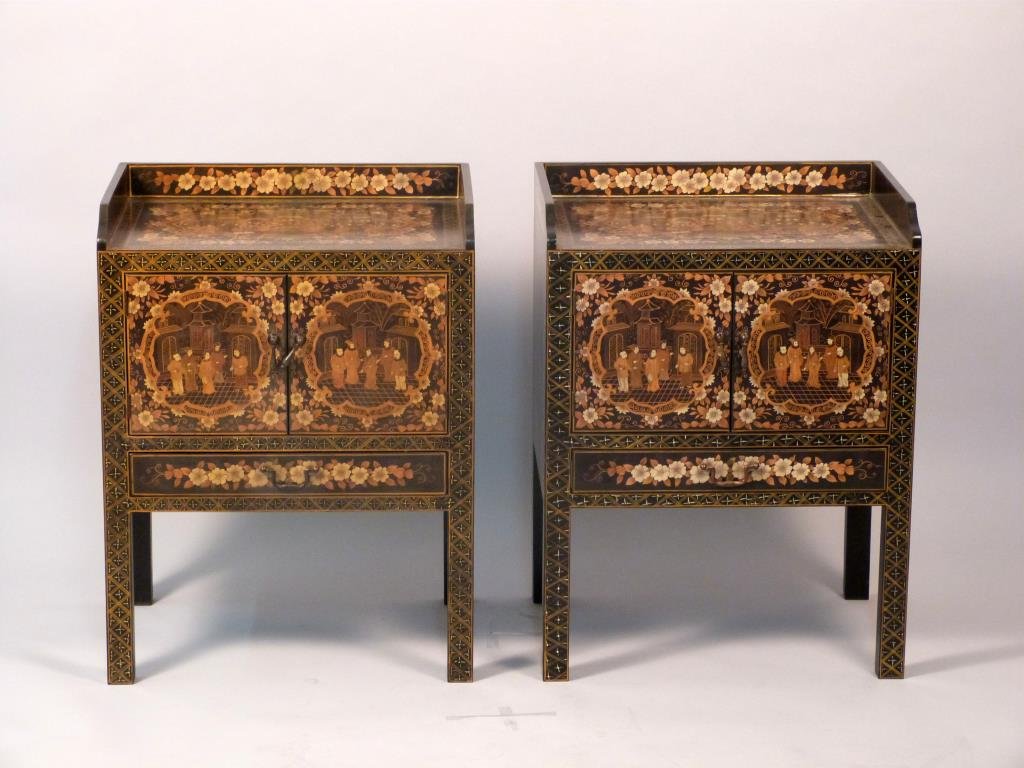 Pair of Chinoiserie End Tables: Galleried tops, ebonized wood with gilt decoration, 2 drawers over 1 door. 22" W X 16" D X 29" H. 1 hinge missing pins.