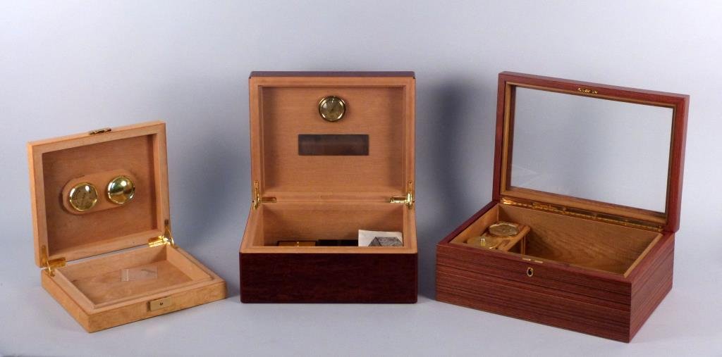 3 Humidors - Elie Bleu, Etc.: Seco: 9 3/4" W X 9 3/4" D X 2 12" H, Elie Bleu: 12" W X 91/2" D X 5" H, Osvaldo Agresti: 13 1/5 W X 9 1/2" D X 5 1/2" H.