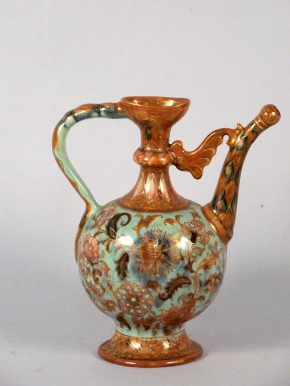 Zsolnay Hungarian Porcelain Pitcher: Arabesque form with elongated spout, underglaze and gilt decorated. 8 1/4" H.