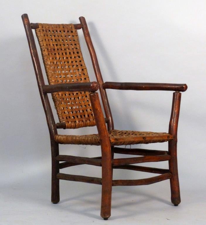 Oversized Vintage Adirondack Style Open Arm Chair: Rattan seat and back. Primitive Styling. 29 1/2" W X 21" D 45 1/2" H. As is.