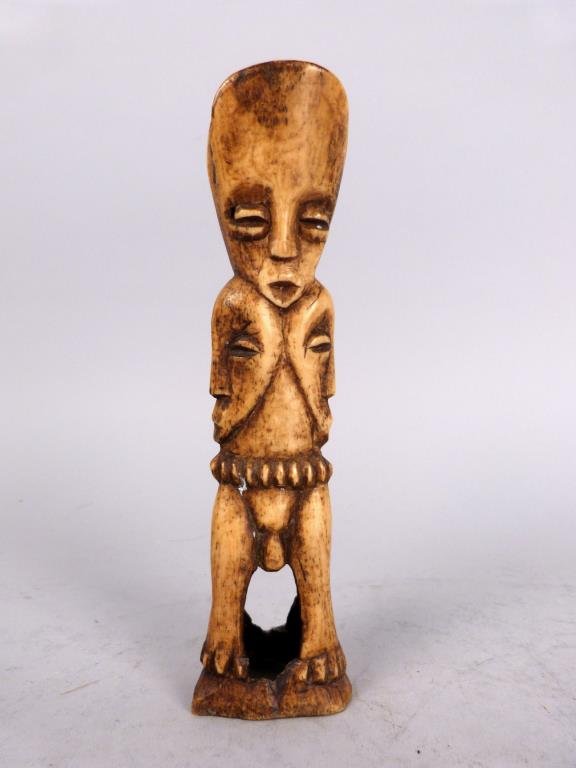 Antique African Carved Bone Janus Figure: Male and female figures with four carved faces. 61/2" H.