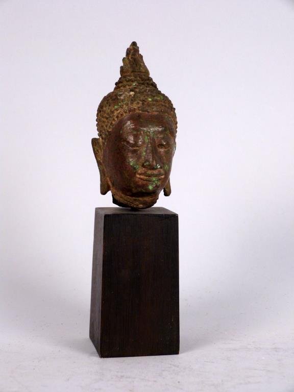 Antique Bronze Thai Buddha Head: With elongated earlobes and elaborate curled hair, mounted on wood base. Head: 3" H; base 21/2" H,
