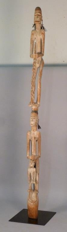 New Guinea Totem Pole - Oceanic Art: 3 figures, 2 adults and 1 child, both adults with spears. on wrought iron stand. 8'6" H (base 18" W X 21" D). Custom crate available (no charge)