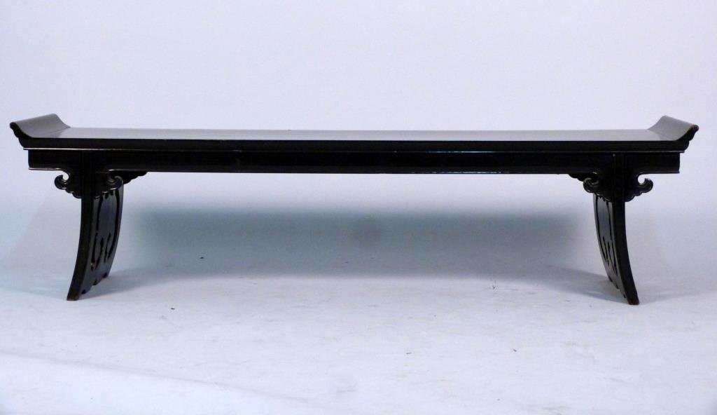 Chinese Low Scroll Reading Table: Made in Hong Kong for Bill Meyers Lamps, ebonized wood, with upturned sides and outward sloping, pieced legs. 61 1/2" W X 15" D X 16" H.