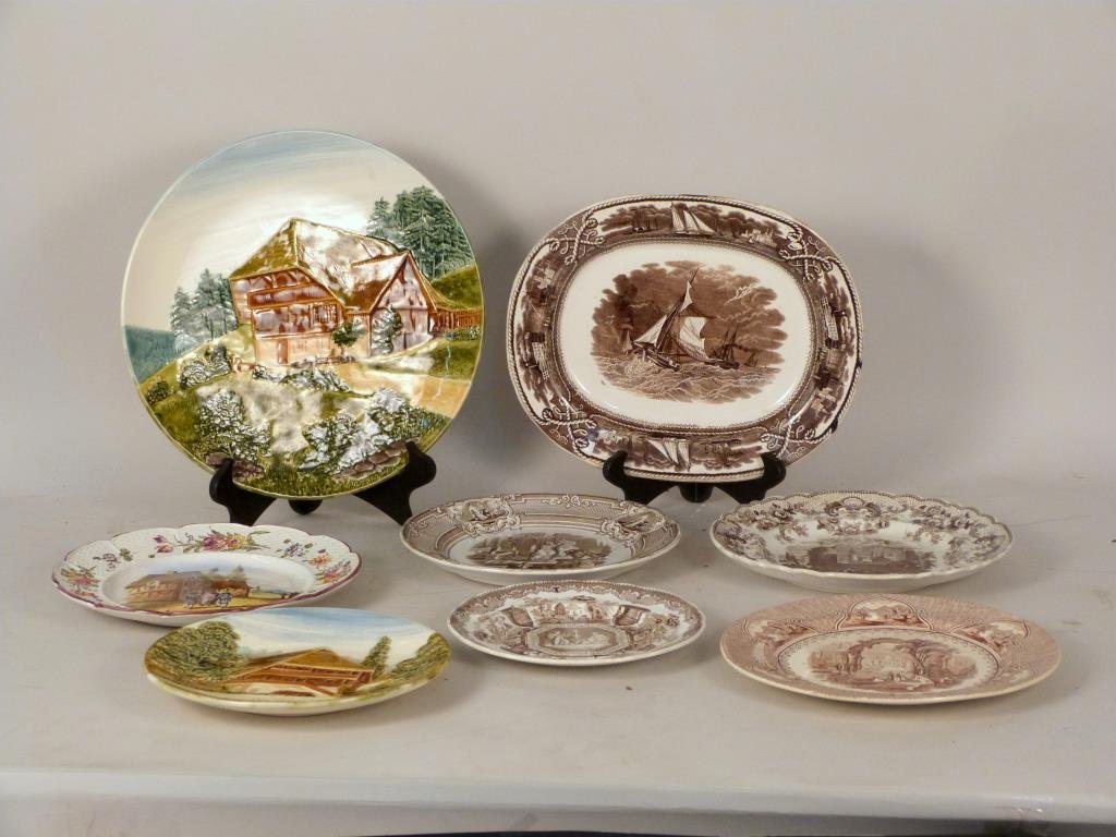 8 Assorted Porcelain Plates: 3 colorfully glazed, 4 brown transfer ware, various brands. Some chips and hairlines.