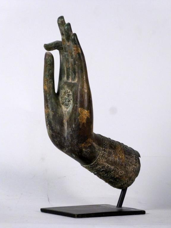 Southeast Asian Style Bronze Buddhist Hand: With index finger and thumb touching, mounted on metal stand. 12" H (mounted). (From a 220 East 65 Street Apartment) <