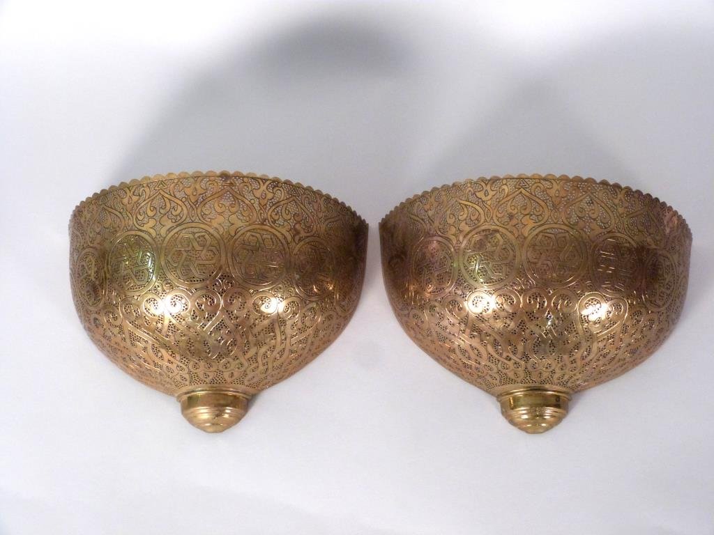 Pair of Middle Eastern Style Wall Sconces: Brass on copper. Ornately pierced and decorated. 11 3/4" W X 8" H. (Property of a Lady)