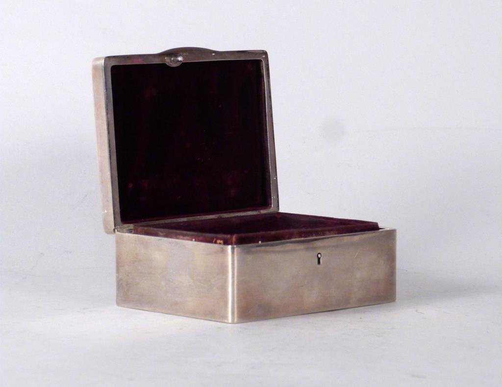 American Sterling Silver Box: Felt lined, engraved top. 4 1/2" W X 3 1/2" D X 1 3/4" H. One dent above hinge. (From a 220 East 65 Street Apartment)