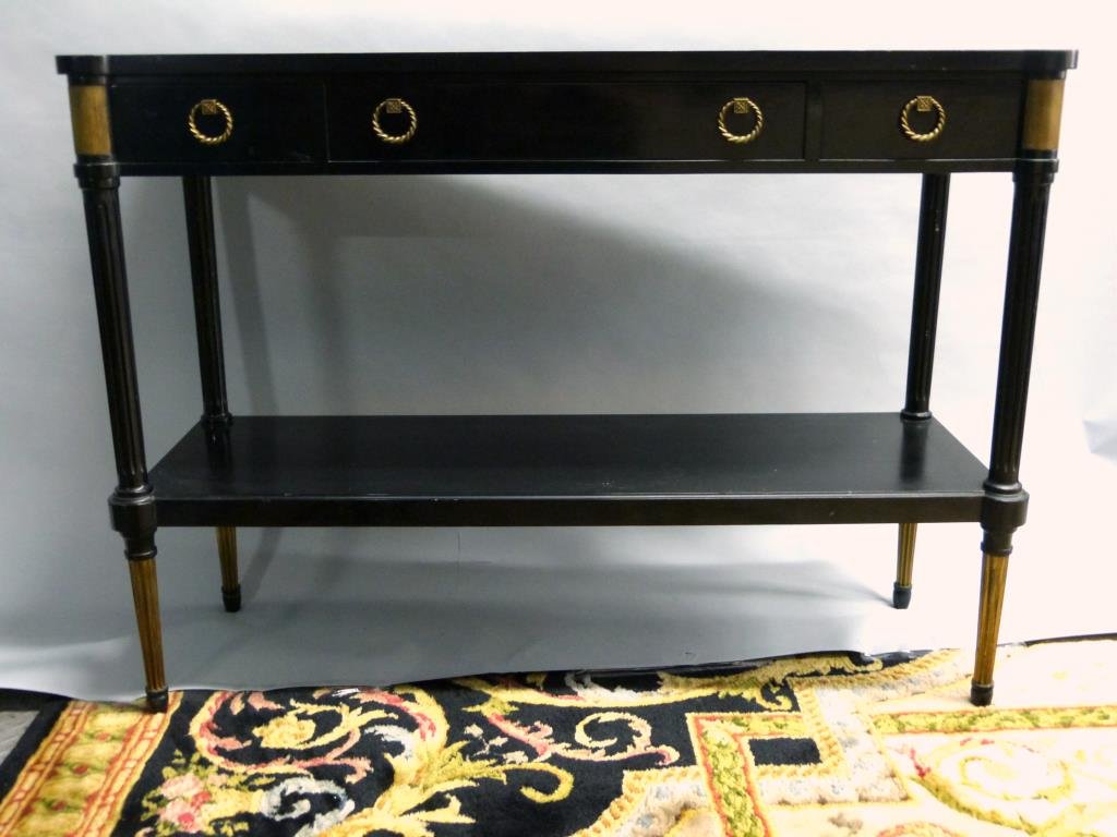 Maison Jansen Style Ebonized Dessert: 2 tier console with 3 inset white marble tops. Gilt metal mounts with brass handles and sharp fluted gilt metal mounted legs. 46"W X 15"D X 33"H. (5th avenue apartment)