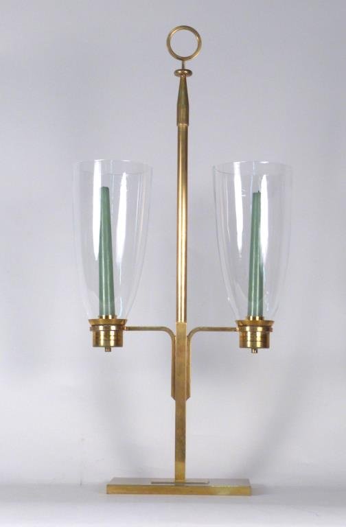 Tommi Parzinger Hurricane Brass Candelabrum: Two lights, ring handle, ribbed candle holders. 13 1/4" W X 27 1/2 " H. (From a Scarsdale Home)