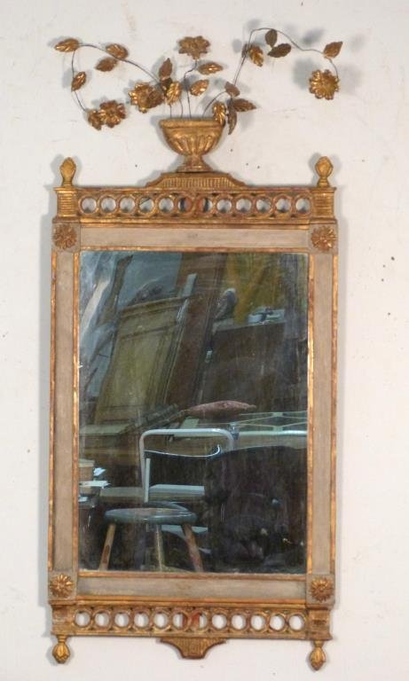 Antique Adam Style Gilt and Painted Mirror **: Carved, painted and gilt wood frame with flower urn pediment having gilt wired gilt wood flowers. (From a 220 East 65 Street Apartment)** Approx. 48" tall X 22" wide. Bottom fret has been previously r