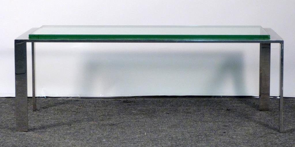 Mid-Century Chrome and Glass Coffee Table: With flat alternating directional legs. 44" W X 22" D X 18 1/2" H; 1" glass.