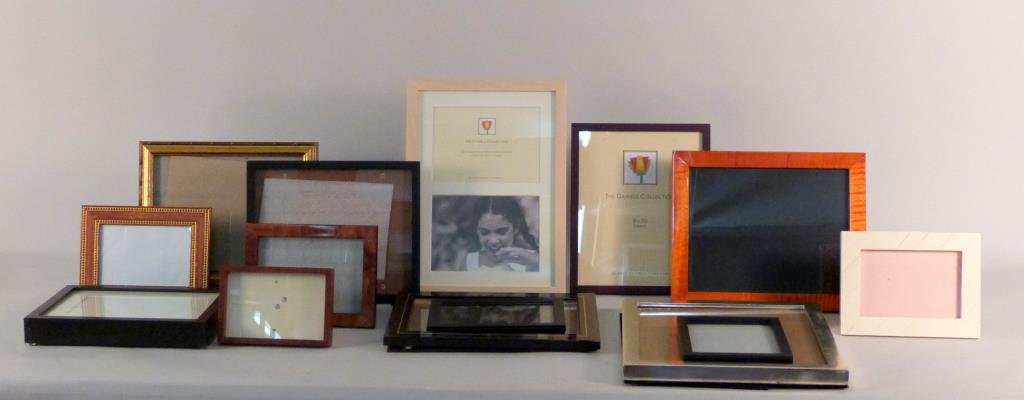 14 Assorted Picture Frames: Wood, leather, and bone. Largest 10" X 8". (From an East Side Townhouse)