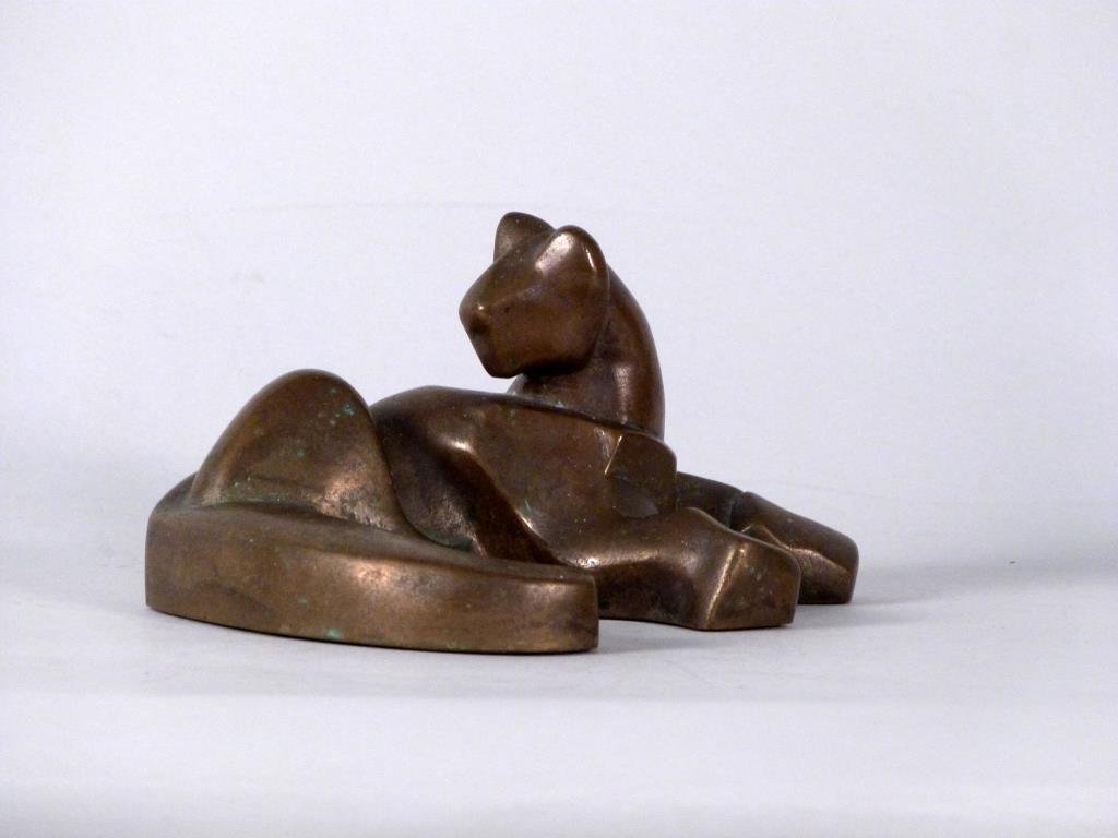 Art Deco Bronze Sculpture of a Cat: Abstractly rendered in recumbent position, marked DVT. 3 1/2" H X 6 3/4" W. (From a 220 East 65 Street Apartment)