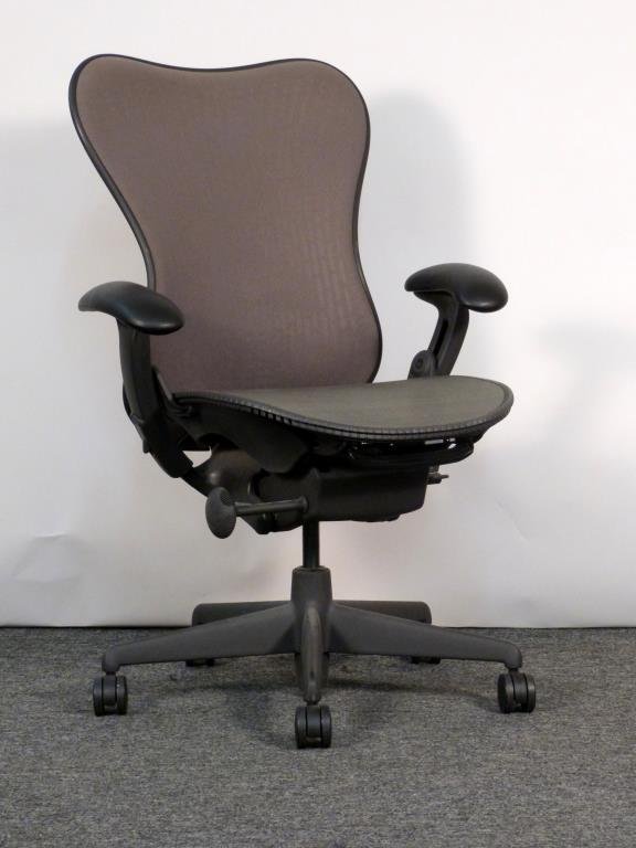 Herman Miller Aeron Chair: Brown/grey mesh back, green/grey mesh seat. 28 1/2" W X 26" D. Some abrasion to rubber and seat back mesh. (From an East Side Townhouse)