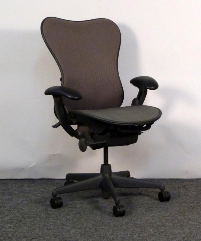 Herman Miller Aeron Chair: Brown/grey mesh back, green/grey mesh seat. 28 1/2" W X 26" D. Tiny bits of wear to mesh on seat and back. (From an East Side Townhouse)