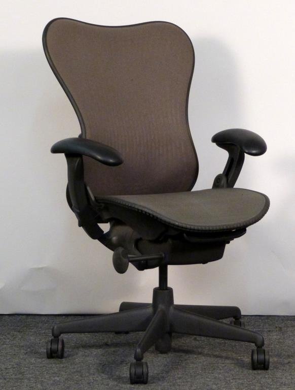 Herman Miller Aeron Chair: Brown/grey mesh back, green/grey. 28 1/2" W X 26" D. Puncture and snag to seat, minor staining to back. (From an East Side Townhouse)