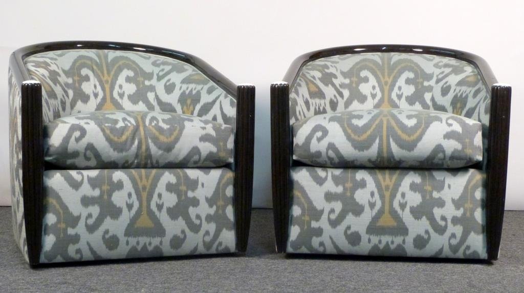 Pair of J. Robert Scott Upholstered Club Chairs: Barrel back lined by ebonized wood trim, tapered, reverse fluted side with bone appointments, swivel. 32 1/2" W X 36" D X 32" H. Some abrasions and losses to lacquer, upholstery in excellent condition