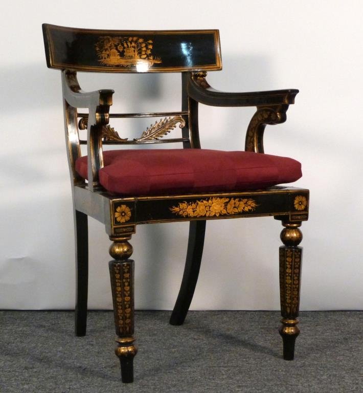 Fancy Sheraton Style Open Arm Chair: Chinoiserie black lacquer ground with gilt decoration, octagonal front legs, cane seat, with seat pad. 21 1/2" W X 22 1/2" D X 35" H. (From an East Side Townhouse)
