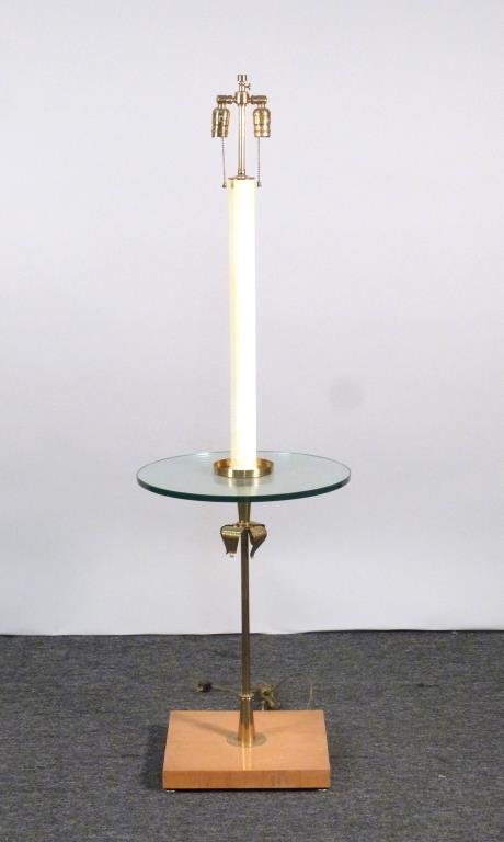 Tommi Parzinger Stick Lamp Table: Brass, with glass shelf and wood base. 54 1/2" H.