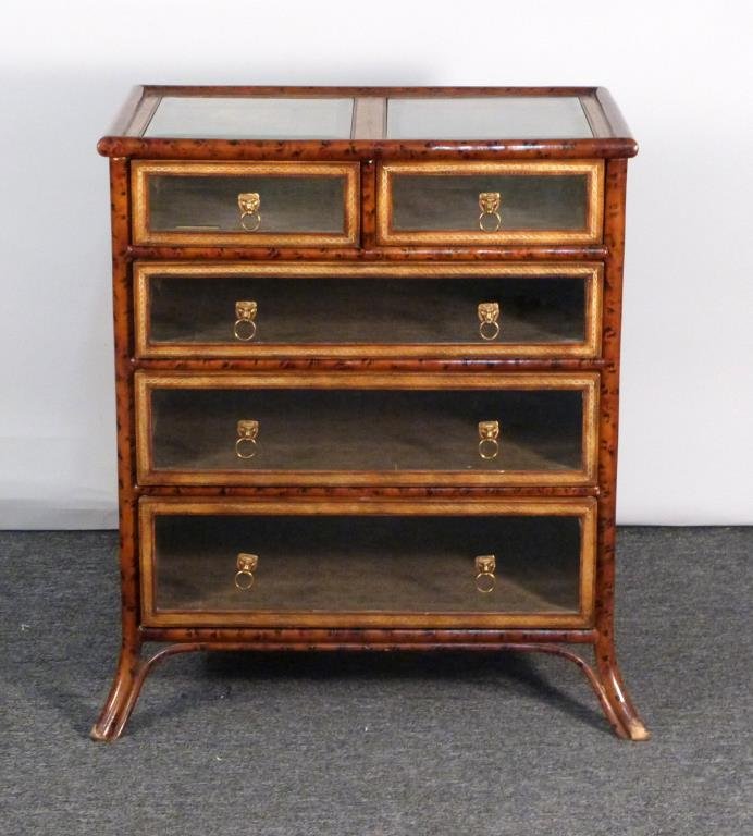 Maitland Smith 5 Drawer Vitrine Display Chest: Faux-bamboo frame with splayed front legs, beveled glass drawer fronts and top, tooled leather sides. 30" W X 18 1/2" D X 32" H.