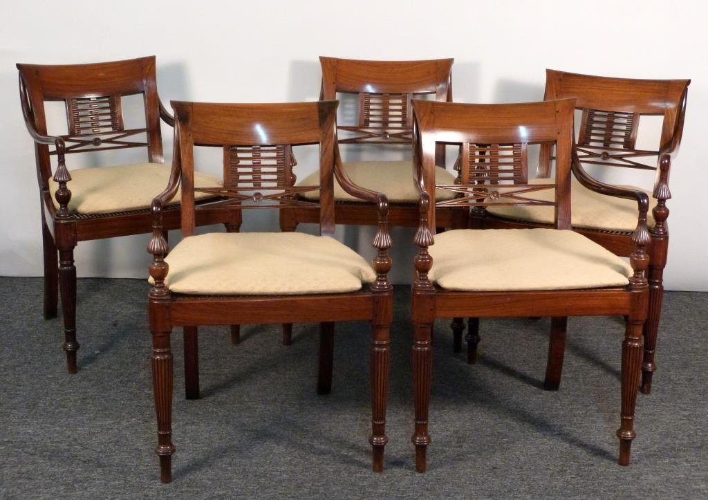 5 Sheraton Style Open Arm Chairs: Pierced back, reverse fluted legs, cane seats, with seat pads. 21" W X 24" D X 31 1/2" H. 1 restored. (From an East Side Townhouse)