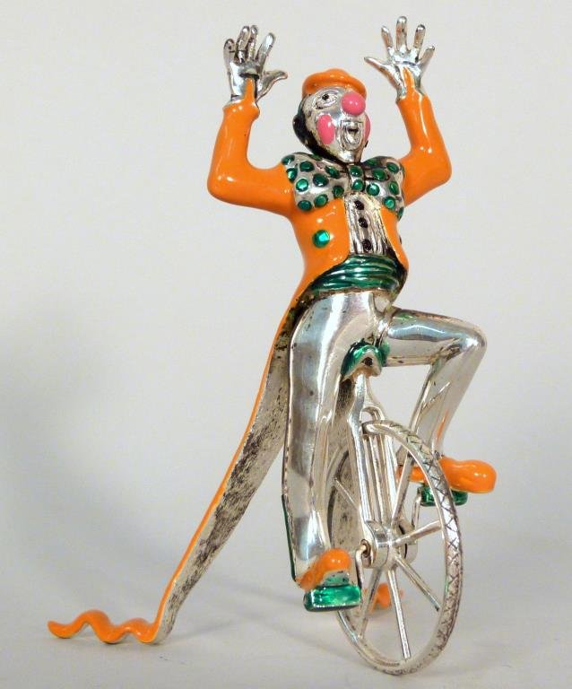 Tiffany & Co. Sterling & Enamel Circus Clown: On unicycle. Designed by Gene Moore. Made in Italy for Tiffany & Co., New York, New York, circa 1990. Marks: TIFFANY & CO., STERLING 925. 4" H. (From a 45 Sutton Place South Former Jewelry Designer)