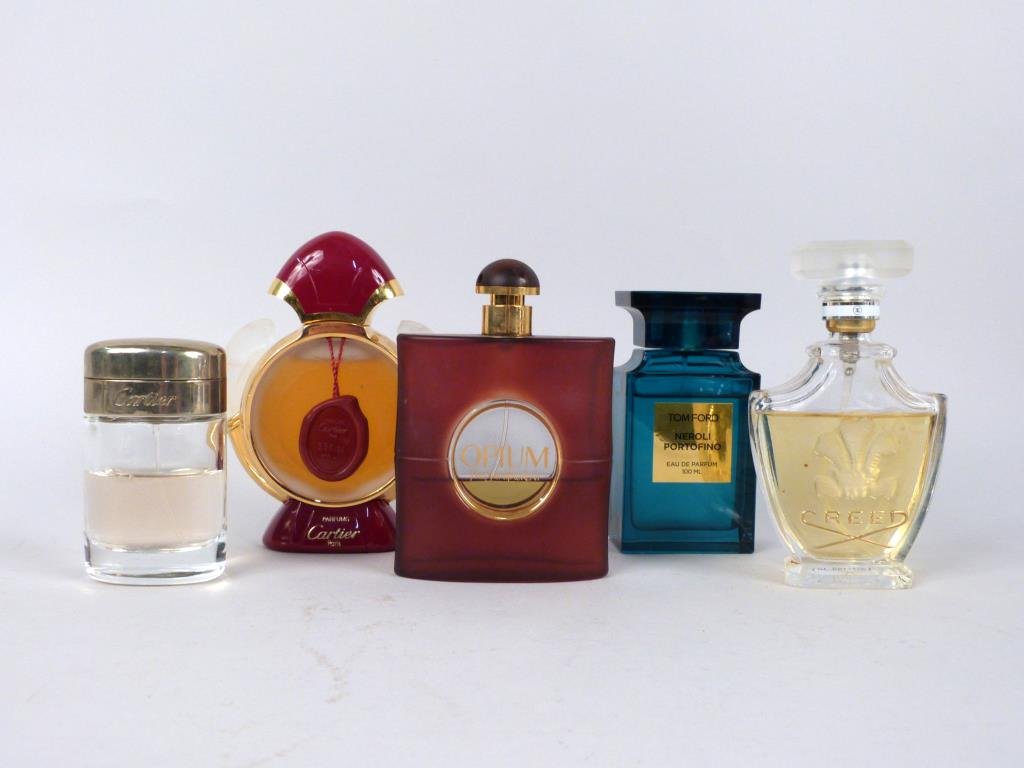 5 Assorted Perfume Bottles: Cartier, Yves Saint Laurent, Tom Ford, and Creed. (Madison Avenue NYC Estate)
