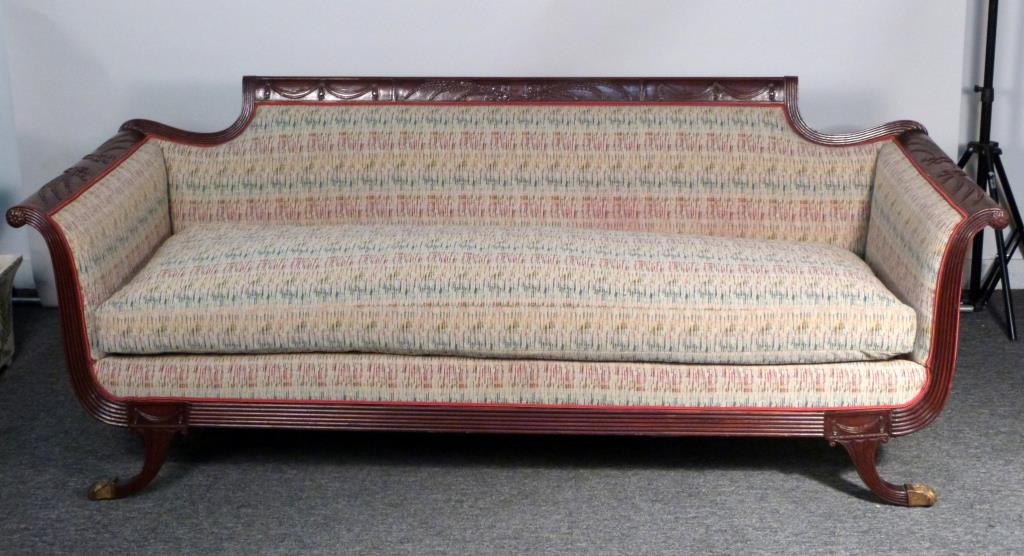 Duncan Phyfe Style Sofa: Sculpted wood frame with wheat and valance decoration, upholstery in excellent condition. 81" W X 32" D X 32" H. (From a 45 Sutton Place South Former Jewelry Designer)