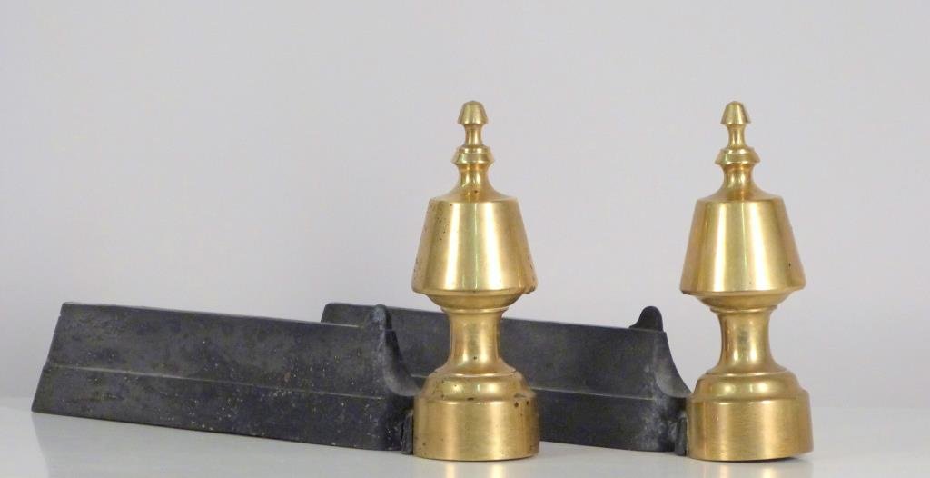 Pair of Petite Brass Andirons: Finial shaped. 14" L X 8" H. (Originally from a Sister Parish decorated apartment in the Carlyle).