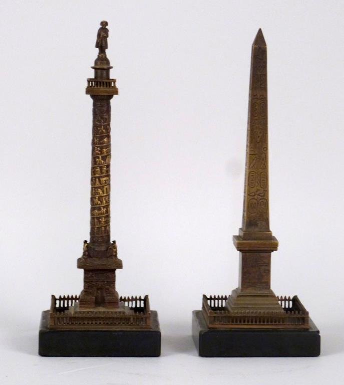 2 Grand Tour Style Bronze Obelisks: Bronze,on marble bases, with relief and incised decoration. 10 1/2" H. As is.