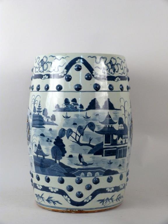 Chinese Blue & White Garden Seat: Porcelain, Cantonese style, decorated with wide band of under glaze blue depicting landscape flanked by stunned decoration. 13 1/2"D X 19 1/2" H. Hairline crack extending from 1" below seat to foot.
