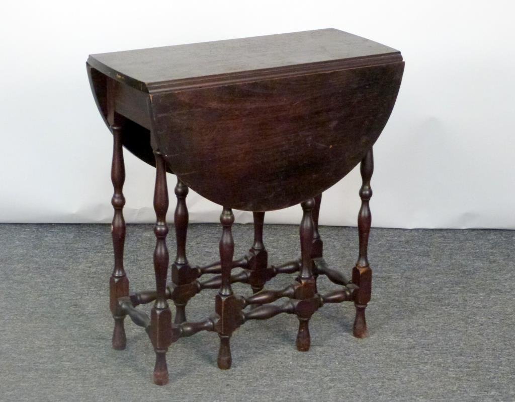 Colonial Style Gate Leg Drop Leaf Table: 1 drawer, with spindle legs, labeled inside. 12" W X 25" D X 27" H; leaves: 12" W. (925 Park Ave Estate)