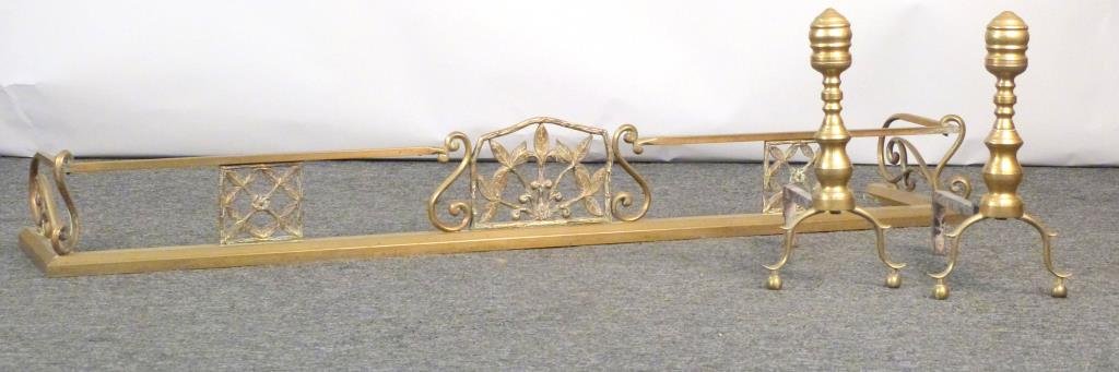 Fire Place Ensemble - Fender & Andirons: Brass plated art nouveau fender (63" W), English style brass andirons. (925 Park Ave Estate)