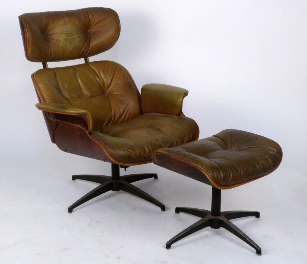 Eames Style Lounge Chair & Ottoman: Vintage reproduction likely by Plycraft. Chair: 32" W X 36" D X 37 1/2" H; ottoman: 21" W X 17 1/2" D X 17 1/2" H. As is. (Prospect Park Brooklyn Property)