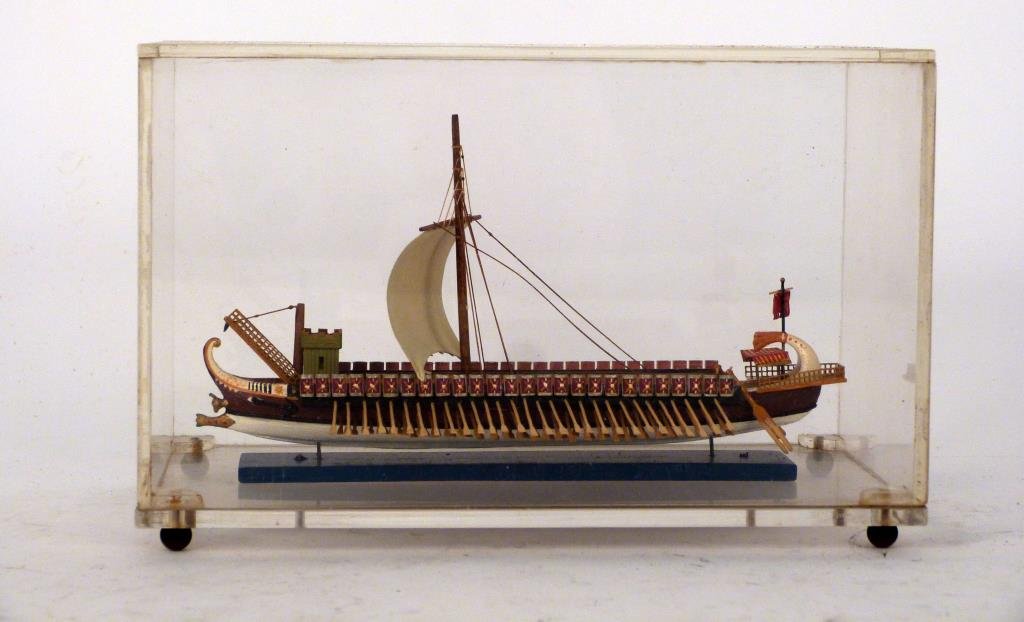 Ship Model in Lucite Case, of an Ancient Vessel: In alucite case. Case: 7 1/2" W X 5" H. (Brooklyn Heights Estate)