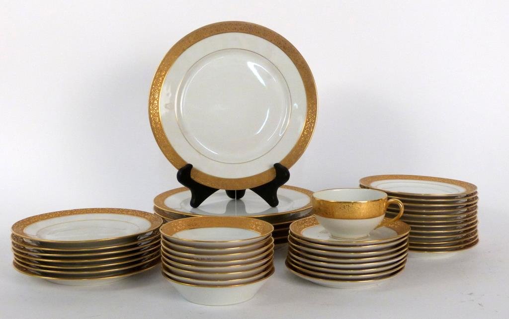 42 Piece Partial Limoges Dinner Service: Porcelain, with gilt decorated rims. 2 large chips. Largest plate: 10" D. (Brooklyn Heights Estate)