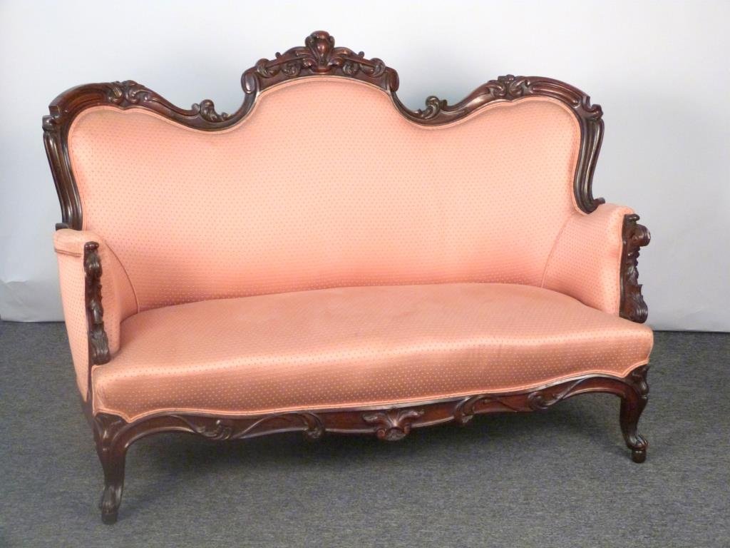 Victorian Finely Carved Triple Back Settee: Carved wood frame with floral decoration, upholstered, casters on rear legs. 62" W X 32" D X 42" H. (925 Park Ave Estate)