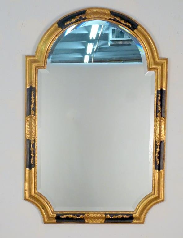 Regency Style Ebonized & Gilt Frame Mirror: With beveled glass, and incised wood designed and shaped frame. 52" H X 35" W.