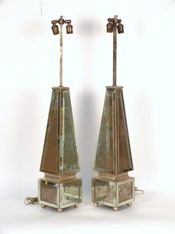 Pair Mirrored Obelisk Form Table Lamps: Tapered bodies on square plinth bases with applied mirror trim, on silvered ball feet. 38" H (24" obelisk).