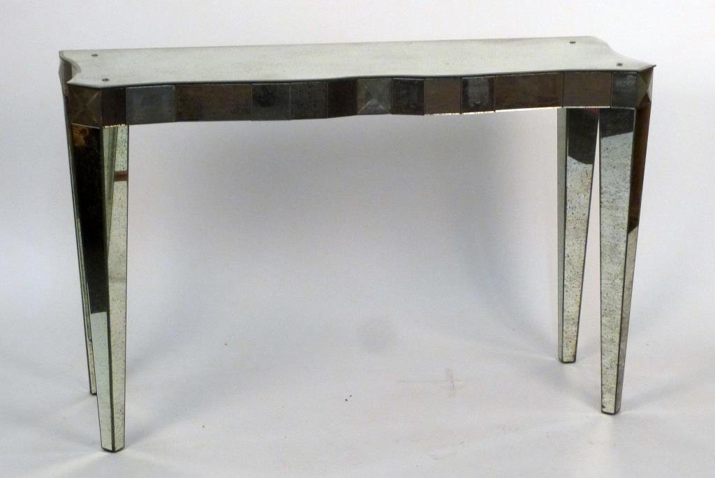 Mid-Century Style Mirrored Console Table: Scalloped front and sides, finished back, mounted mirror panels, on square tapered legs. 48 1/2" W X 17" D X 31" H.