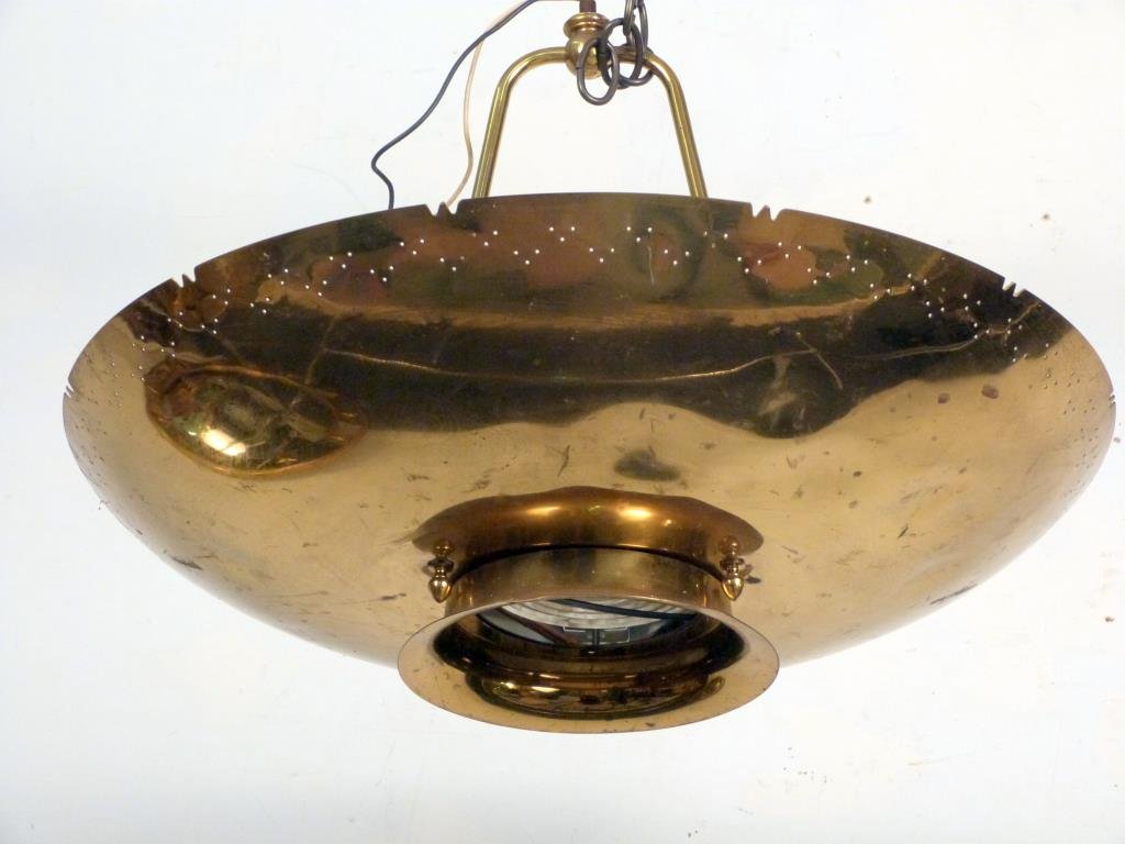 Paavo Tynell Style Chandelier: Perforated brass, with glass diffuser, 5 lights. 22" D X 16" H. Some small dents and scratches.