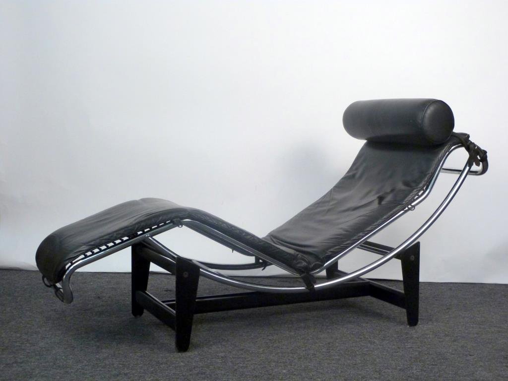 Le Corbusier Style Chaise Lounge: Leather seat on chrome frame, with steel base, no tags.63" L X 21" W X 31 1/2" H (at highest). Minor wear.