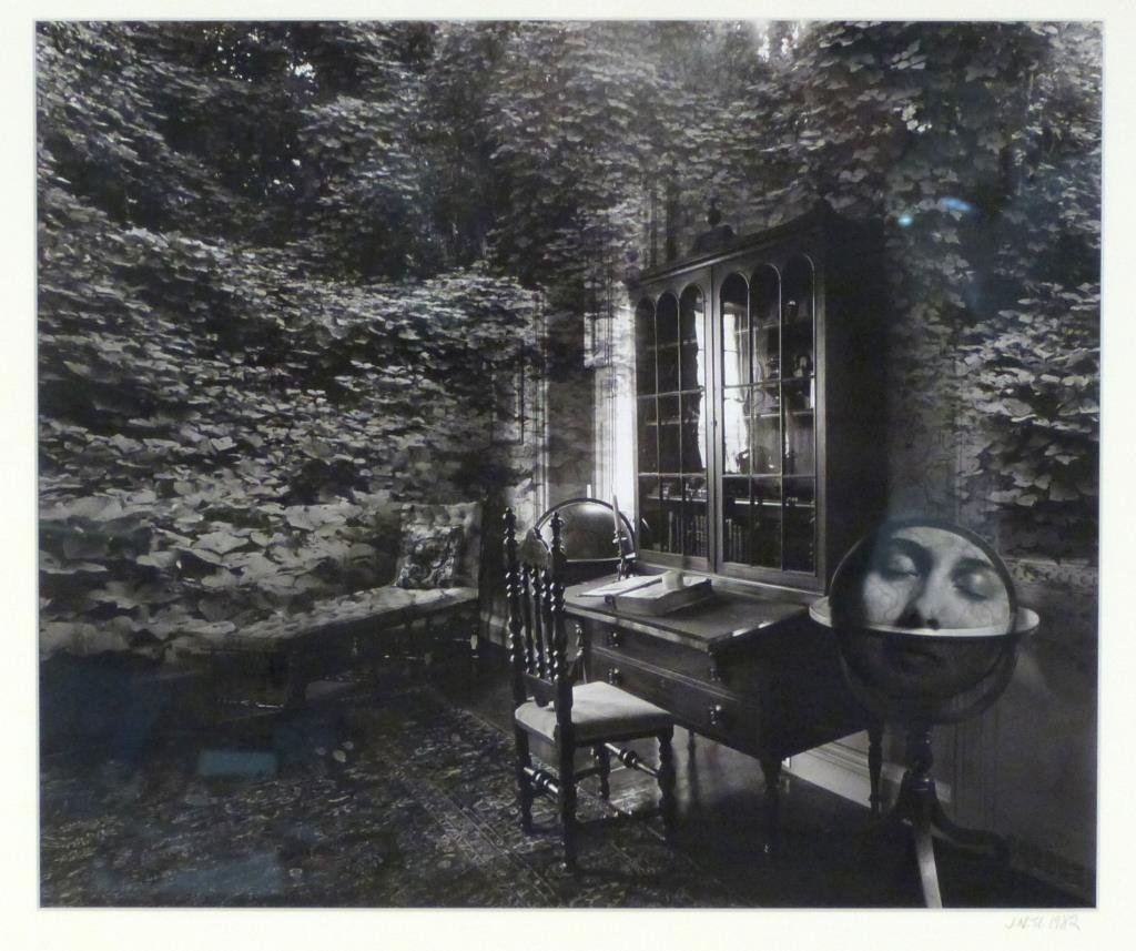Jerry Norman Uelsmann (American,b. 1934) - Photo: Untitled (Kudzu room with face/globe), signed and dated 1982 lower right, silver gelatin print. 16" H X 20" W (22 1/2" X 28 1/2"). Witkin Gallery label on verso.