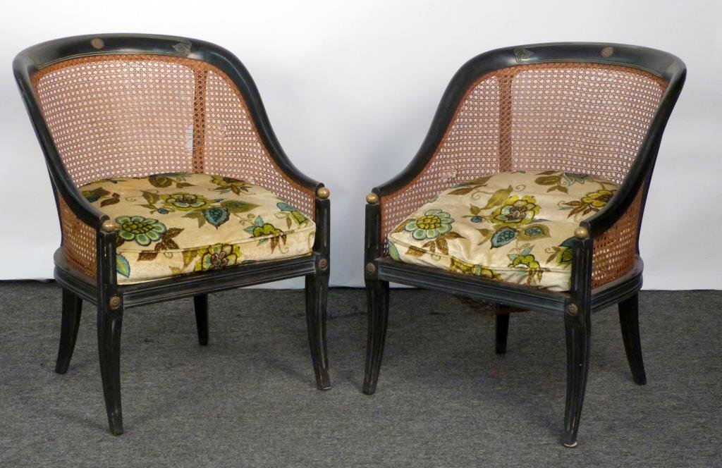 Pair of Regency Style Arm Chairs: Ebonized carved wood frame with incised carving and bronze roundels, cane seats as is. 23" W X 25" D X 31" H.