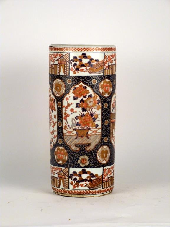Japanese Porcelain Umbrella Stand: Decorated with under glaze and enameled decoration. 18 1/2" H. (401 East 65 Street Estate).