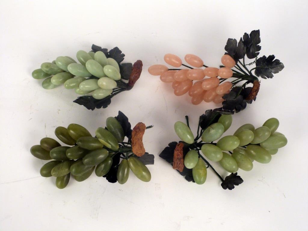 4 Hardstone Grape Sculpture Groups: Jade, soapstone, and rose crystal. Each approximately 8" L. (401 East 65 Street Estate).