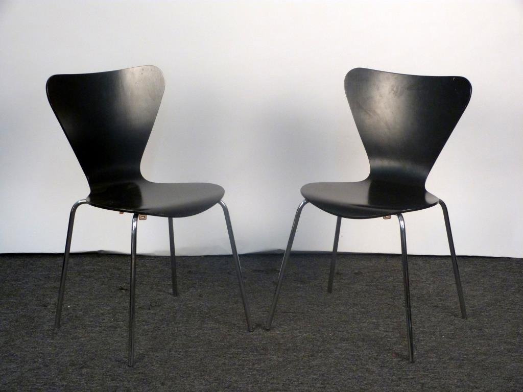 Pair of Arne Jacobson Style Side Chairs: Chrome legs, ebonized molded plywood seats. 17 1/2" W X 20" D X 31" H. Wear to seats.
