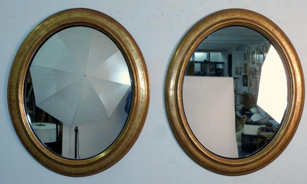 Pair Mid-Century Large Oval Mirrors: Gold leaf molded frames. (slight chips). 39" X 33".